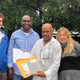 Elvis Brooks (holding papers, center), flanked by his brother Aaron Brooks, Innocence Project New Orleans attorney Charell Arnold (right) and investigator Jack Largess (left) after Elvis Brooks’ release from prison Oct. 16, 2019, after spending 42 years behind bars for a murder he says he didn’t commit
